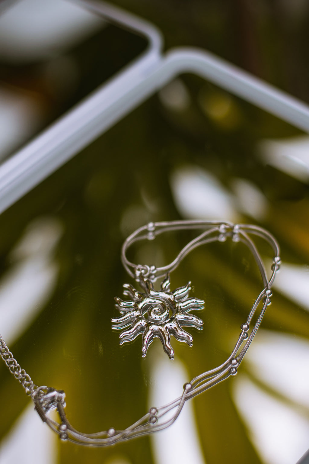 The Say It Softly Charm, silver sun charm